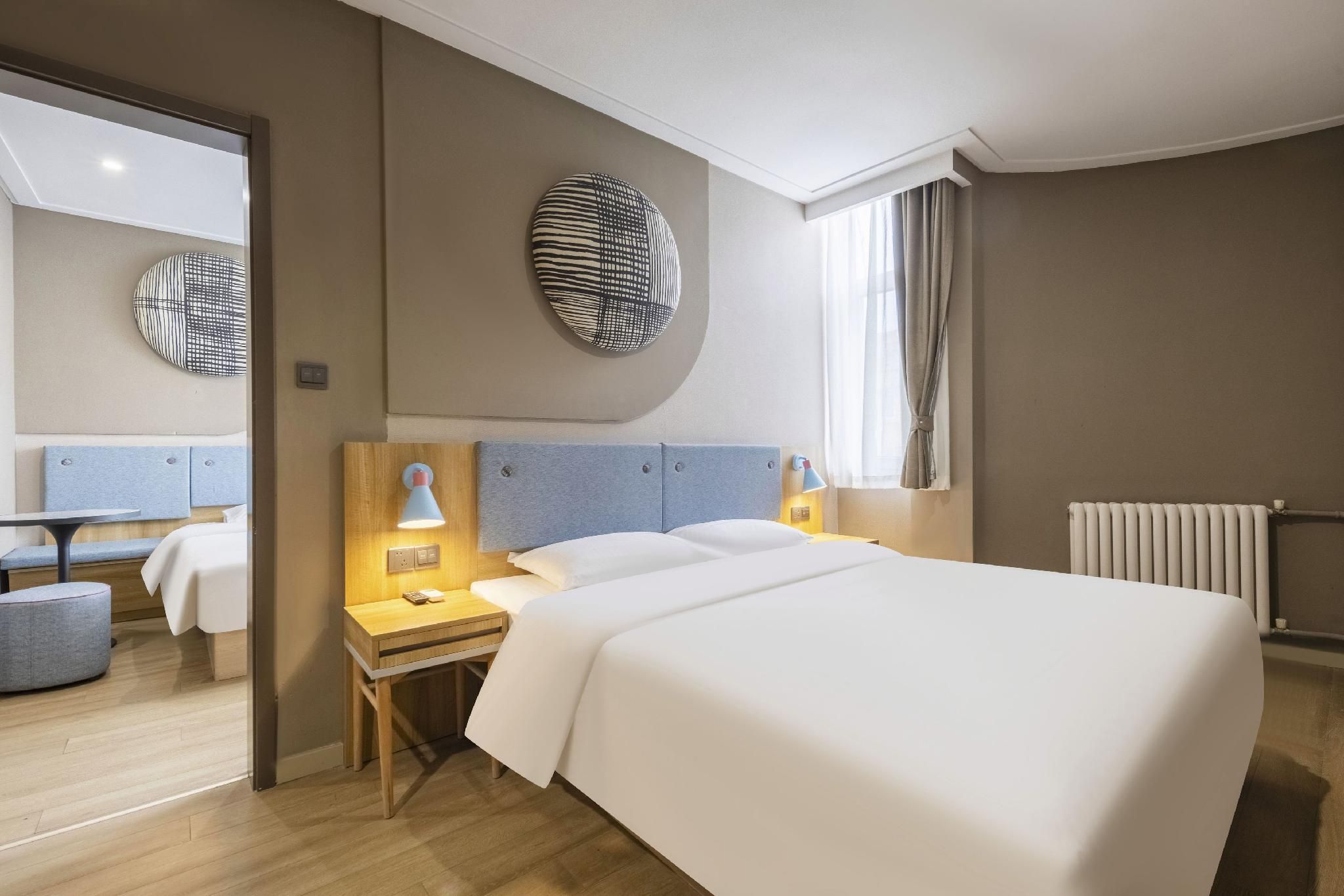 Home Inn Neo Qingdao Taidong Metro Station Lijin Road - تشينغداو - غرفة نوم