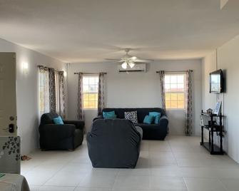 Peace in Every Step in this Picturesque Property! - Ladyville - Living room