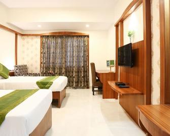 Treebo Premium Akshaya Mahal Inn - Mysore - Bedroom