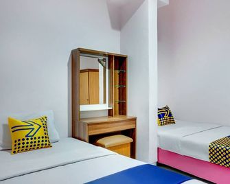 Hotel O Wisma Jampea - מקאסר - חדר שינה