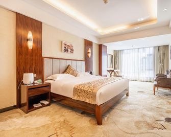 Jiusheng International Hotel - Gannán - Habitación