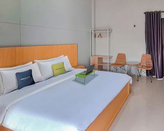 Urbanview Hotel Griya Menteng Palangkaraya by RedDoorz - Палангкарая