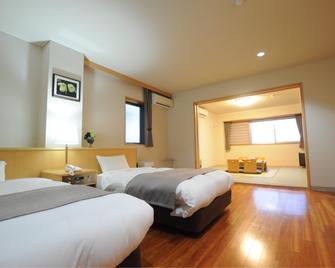 Hotel Unigoten - Rishirifuji - Camera da letto