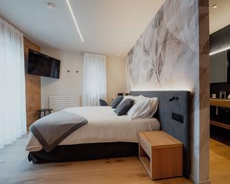 Mostesi Dolomites Spa Hotel - Auronzo di Cadore - Schlafzimmer