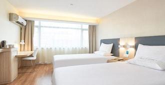 Huating Hotel - Huai'an - Schlafzimmer