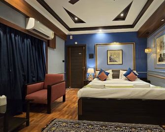 Hotel Trimoorti - Kolkata - Bedroom