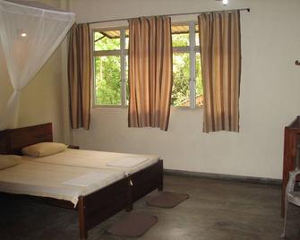 Spacious Rooms with /Attached Bathrooms /Travellers Paradise - Habarana - Bedroom