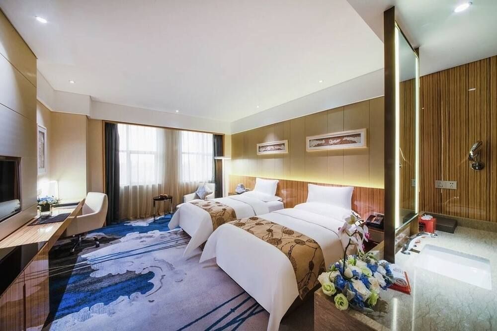 ينتشوان اكسفوجنج هوتل - ينتشوان - غرفة نوم