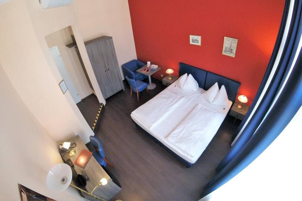 Bedroom view of Hotel Pension Excellence