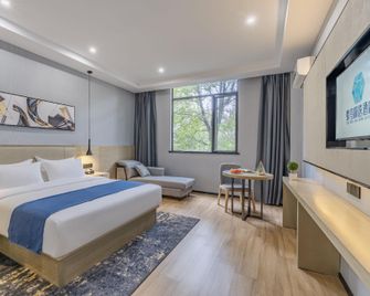Hummingbird Select Hotel (Huangshi Huahu Avenue Wanda Plaza Branch) - Huangshi - Bedroom