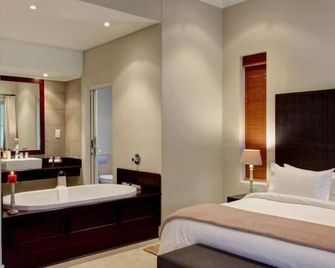 Gaikou Lodge - סוולנדאם - חדר שינה