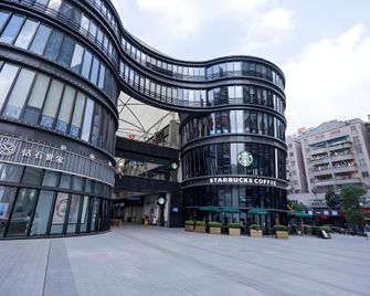 Vienna International Hotel Guangdong Dongguan Shilong Huixing Commercial Center - Dongguan - Gebouw