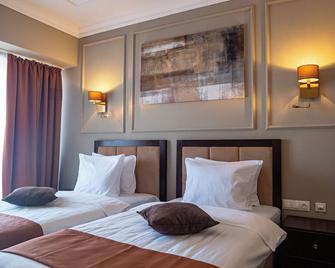 آلماتي هوتل - ألماتي - غرفة نوم