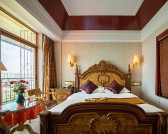 Golden Zone Hotel - Xishuangbanna - Habitación