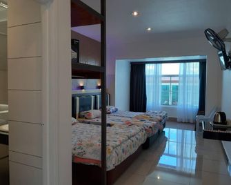 Strawberry Garden Hotel - Ranau - Camera da letto