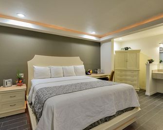 Romantic Inn & Suites - Dallas - Schlafzimmer