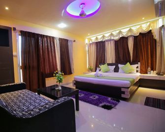 Hotel Pushpa (Berries Group Of Hotels) - Puri - Habitación