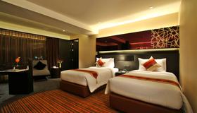 Golden Tulip Mandison Suites - Bangkok - Schlafzimmer