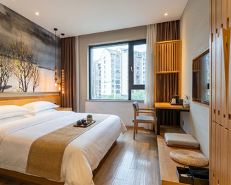 Yongli Zen Hotel (Shangrao Wanda Shuangta Park) - Shangrao - Спальня