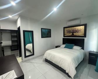 Hotel Minerva - Tamasopo - Slaapkamer