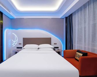 Qingdao Conson Sports Center Hotel - Qingdao - Habitació