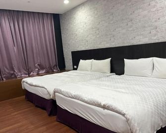 Tie Dao Hotel - טאינאן - חדר שינה