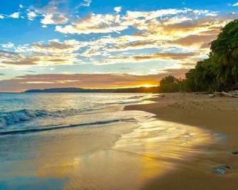 Castillo Tambor by the North Pacific Ocean surrounded by lush tropical forest. - Tambor - Playa