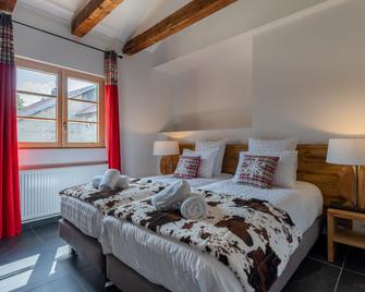 Géraniums Et Neige Fraîche, Maison d'Hôtes avec Suites Haut de Gamme, Balnéo massante et Sauna privés - Métabief - Chambre