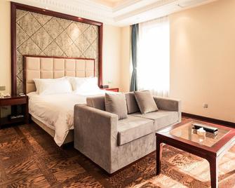 Shenyang Suisse Place Hotel Residence - Shenyang - Bedroom