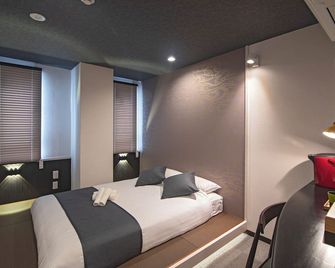 يويو يوكيو هوتل - أوساكا - غرفة نوم