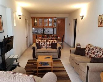 3 Bedroom 2 Bathroom Apartment. Sleeps family of 6.brVery comfortable and safe br - Six Cross Roads - Living room