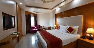 Hotel Anand International - Bodh Gaya - Bedroom