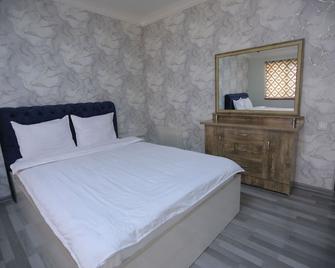 Payitaxt Hotel - Andiján - Habitación