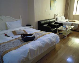 Dalian Ming Rui Jin Feng Apartment - Dalian - Bedroom