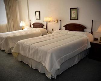 Hotel Excelsior Inn - אסאנסיון - חדר שינה