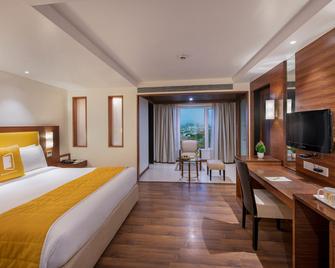 BloomSuites l Ahmedabad - Ahmadabad - Soveværelse