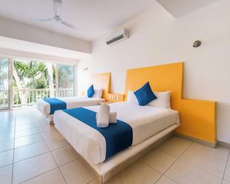 Hotel Ixzi Plus - Ixtapa - Schlafzimmer