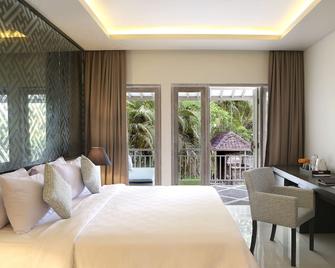 Segara Village Hotel - Denpasar - Schlafzimmer