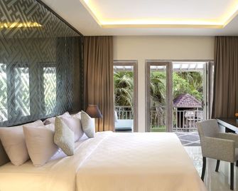 Segara Village Hotel - Denpasar - Camera da letto