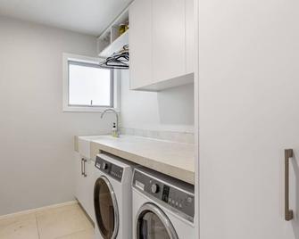 Spacious family home in Meadowbank| by Furnished Rentals - Auckland - Laundry facility