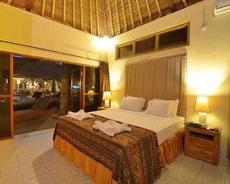 Bayside Bungalows - Manggis - חדר שינה