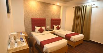 Hotel Prag Continental - Guwahati - Camera da letto