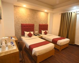 Hotel Prag Continental - Guwahati - Camera da letto