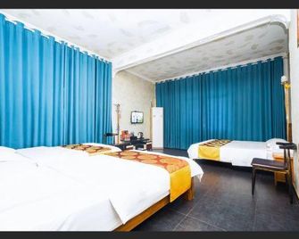 Zhangjiajie Different Inn - Zhangjiajie - Makuuhuone