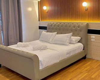 H Mansion Hotel - Tandag - Camera da letto