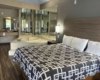 Regency Inn & Suites by Capital O Houston Iah Airport - Humble - Phòng ngủ