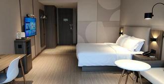 Hanting Hotel Wuxi Taihu International Science And Technology Park - Wuxi - Bedroom