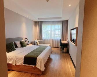 Greentree Inn Shangrao Wuyuan Bus Station Tang Village Express Hotel - Shangrao - Slaapkamer