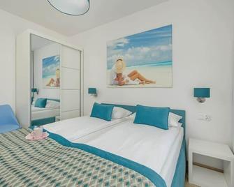 Apartament Marina 2 Seaside Atmosphere Kołobrzeg by Noclegi Renters - Kołobrzeg - Schlafzimmer