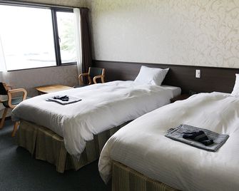 Sado Onsen Onjuku Oginoyu - Sado - Camera da letto